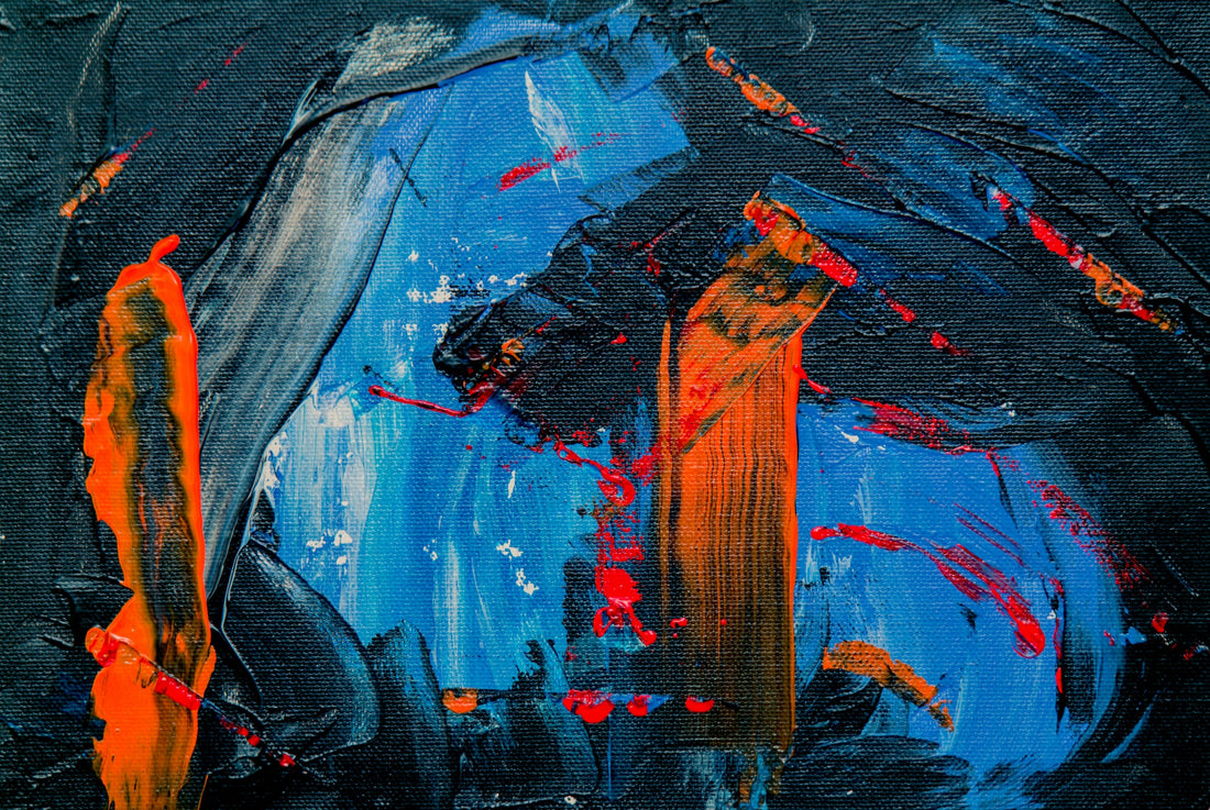 A painting of thick blue, dark blue and orange strokes.